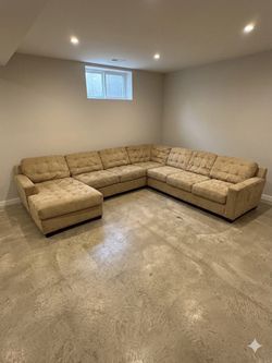 Tan Tufted U-Shaped Sectional Sofa