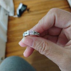 Small Pink Diamond With Smaller White Diamonds Around The Band 