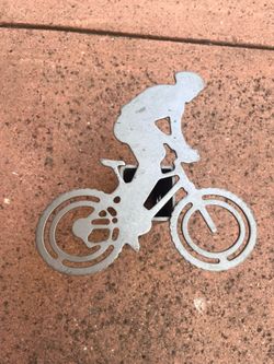 Mountain bike rider trailer hitch cover