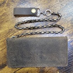 Brand new hand crafted genuine leather wallet with 24" stainless steel chain.

$75 FIRM