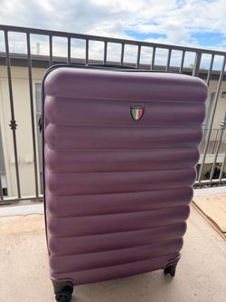 Purple hardshell suitcase