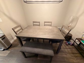 Dining room table with chairs and bench