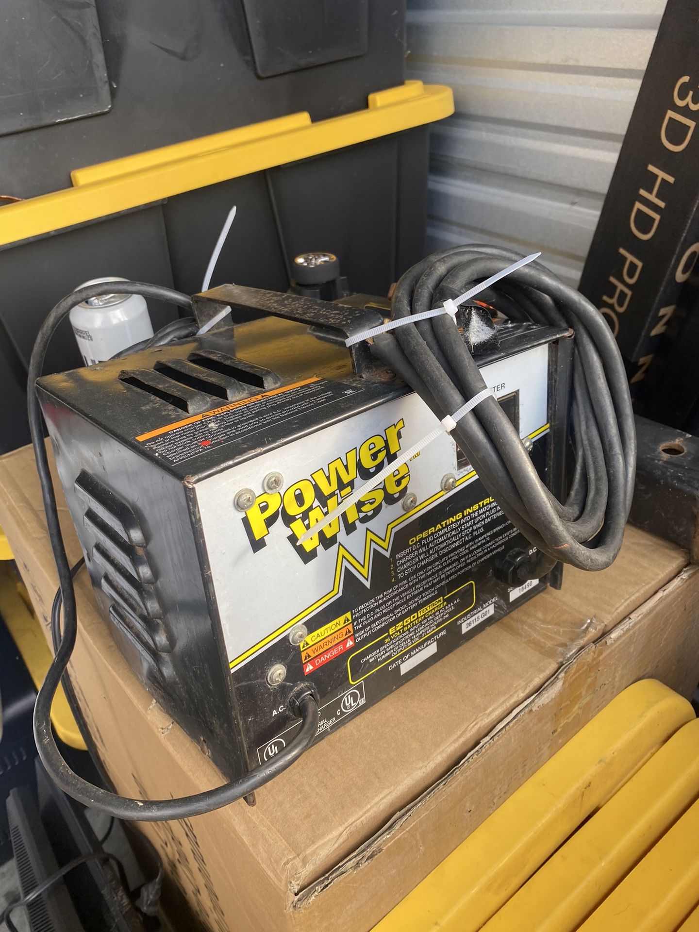 Powerwise 36 Volt EZ-GO TXT Golf Cart Battery Charger. It's designed to charge 36-volt batteries in EZ-GO golf carts and features a "D" style plug
