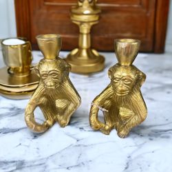 set of two gold monkey candle holders 