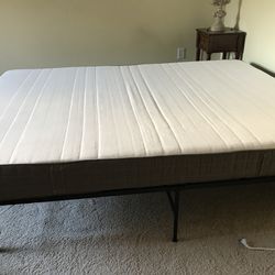 Queen-size mattress with bed frame