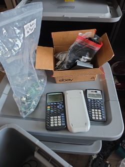 Assorted video game repair parts and calculators