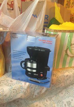 12v coffee maker with traveling mug. Brand new in box..