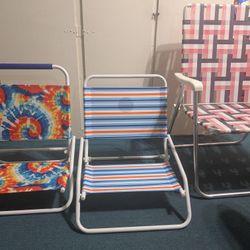 3 Beach Chairs And Umbrellas