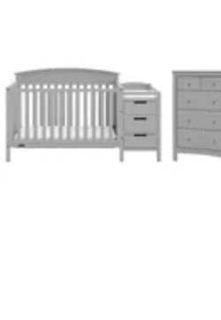 NEW—Crib And Side Table Concert Into Day Bed. PICK UP ONLY