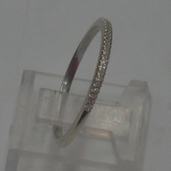 14KT WHITE GOLD THIN BAND WITH 23 DIAMONDS APP 0.10 TOTAL 1.6 GRAMS SIZE 9.25. 885195-4. 