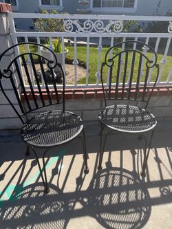 2 rod iron chairs