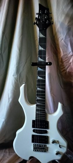 Brand new electric guitar with new bag cable and shoulder strap