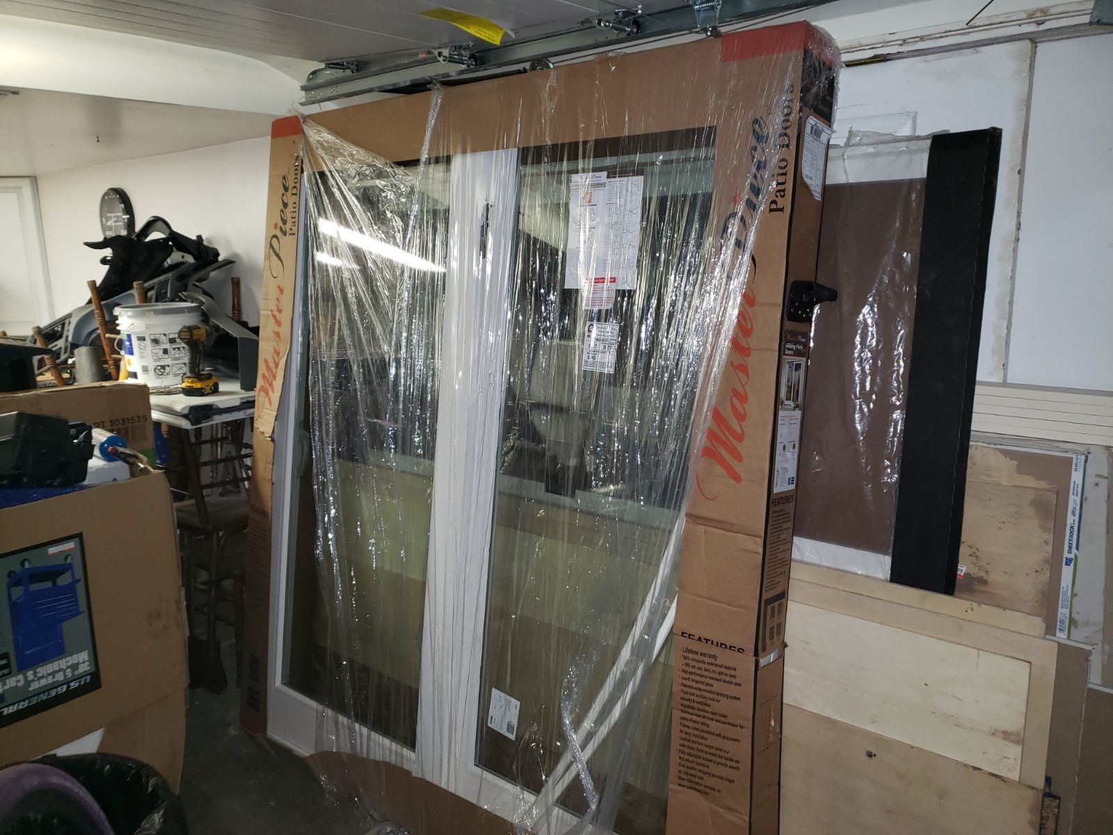 Brand new sliding glass door Made by masterpiece patio door brand new in the Box lock with key comes with it asking $450 door sells for almost $600