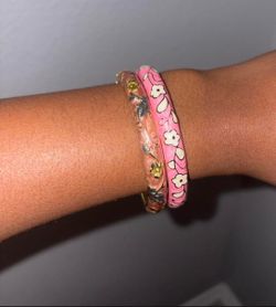 Brown and pink floral decorated bangle bracelets