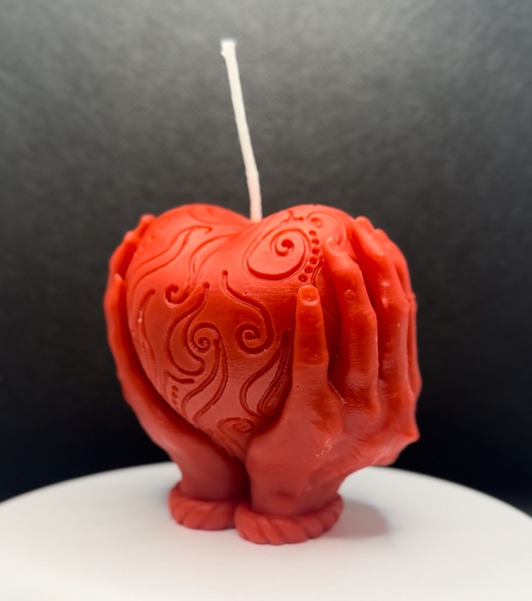 Heart in hands candle