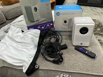 HP CC200 FHD LCD LED Projector with Roku Express Streaming Player and 84" Mobile Projection Screen like new only used twice works great asking 80