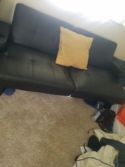 Black leather futon/fold out bed