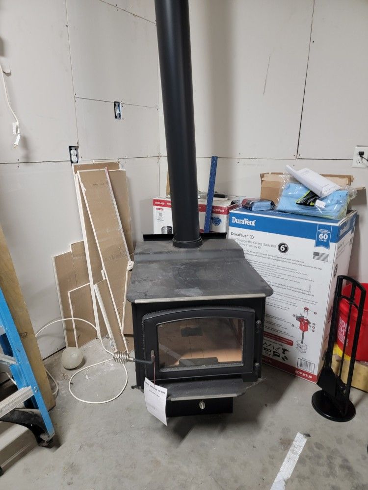 us stove company new wood stove with pipe kit.  heats up to 3200sq ft