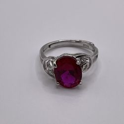 A lab created ruby ring on sterling silver with an adjustable band.