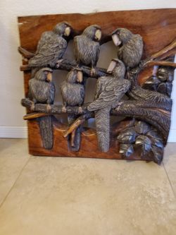 Carved one piece of wood. 21 inch wide by 21inch in lenght and 2 to 5 inch thick. Solid wood picture. Asking $340