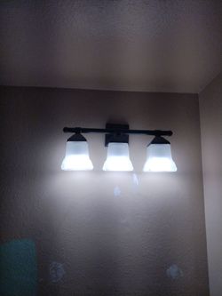 Bathroom light fixture and matching decorative hooks