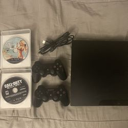 PS3 w/ 2 Controllers + 4 Games