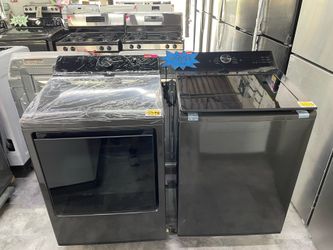 LG washer 5 cu ft and dryer 7 cu ft in black stainless steel