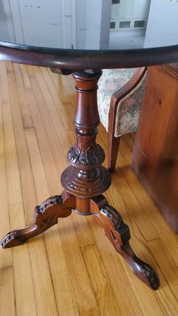 Antique style wood table with glass top