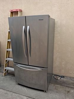 Free Kitchen Aid Refrigerator and TV stand