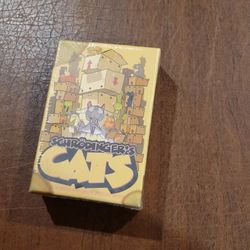 Schrodinger's Cats - Card Game New Sealed. UPC 98. Contents: 
Rule book, 52 box cards, 10 cat physicists, lab clipboard tracker, 
wooden box