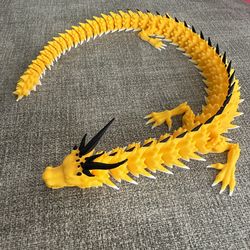 Articulated 16” yellow, black and white dragon