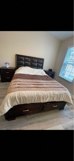 Moving out. Queen bed Wood and leather, two drawers on the bottom, excellent condition like brand new.