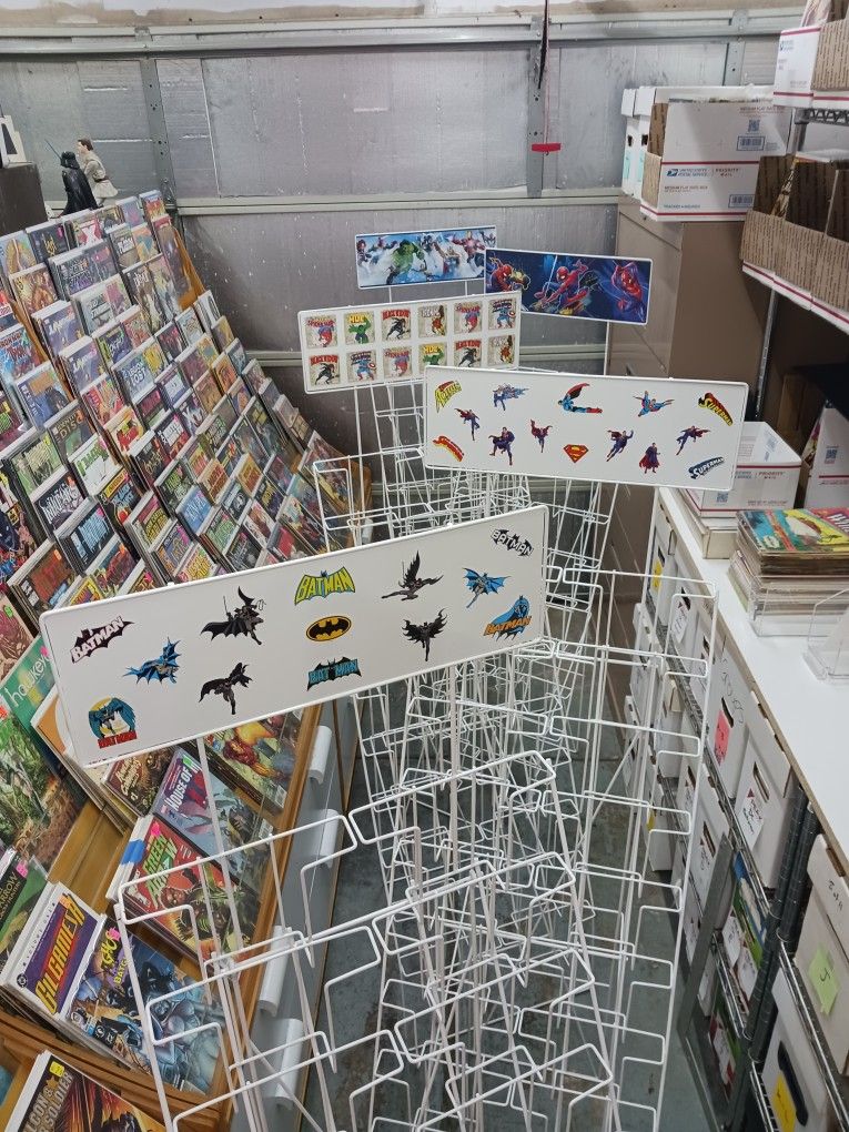 Comic book/magazine easel style wire racks 20 pocket. $40 each. Spider-Man, Batman, Superman themed.