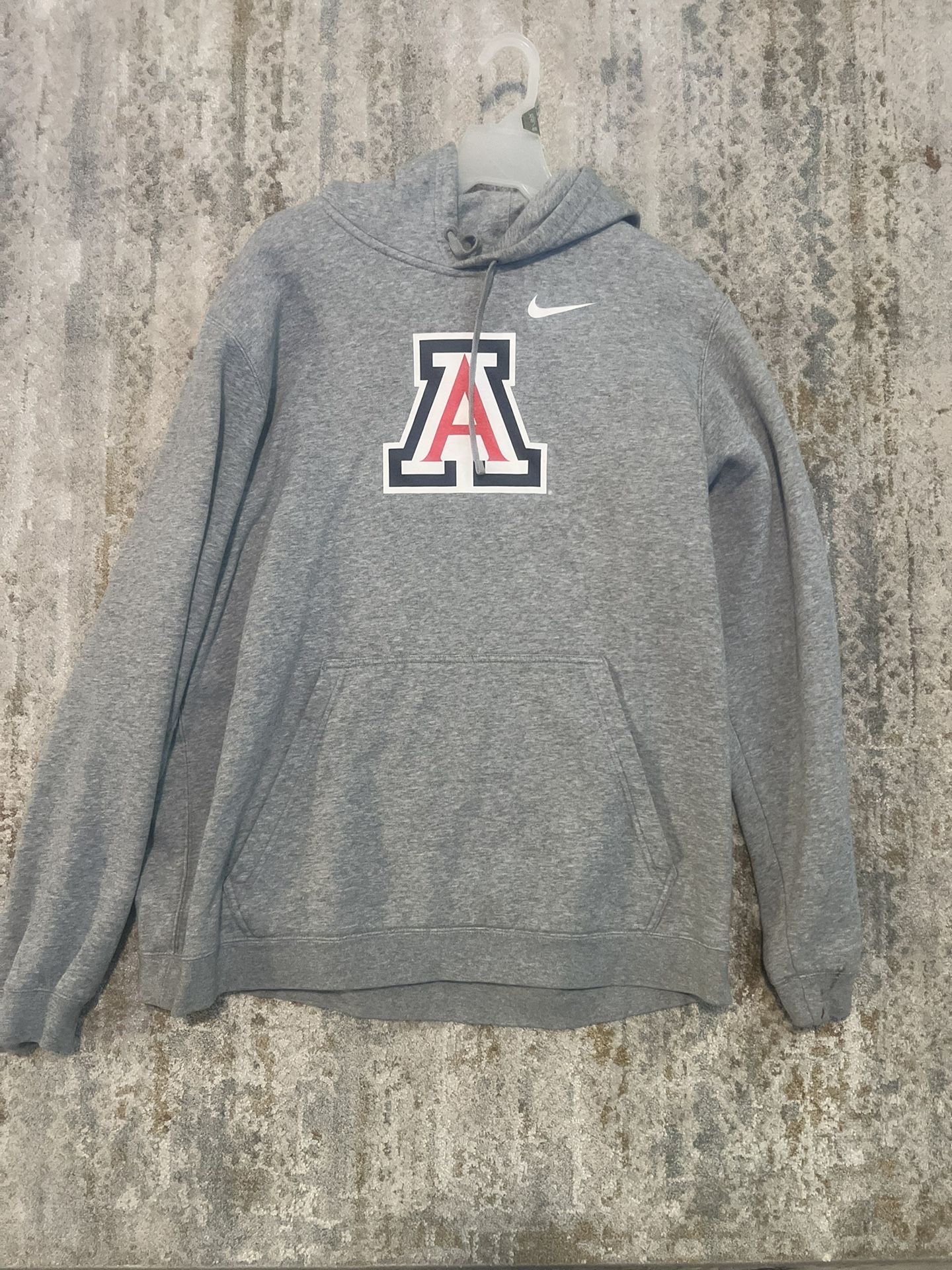 University of Arizona Nike Gray Hoodie with Blue Tag size XL Small stains shown in last two pictures Soft gray hoodie with a classic Nike logo. Fea