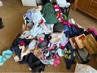 Large pile of women’s clothes and misc stuff