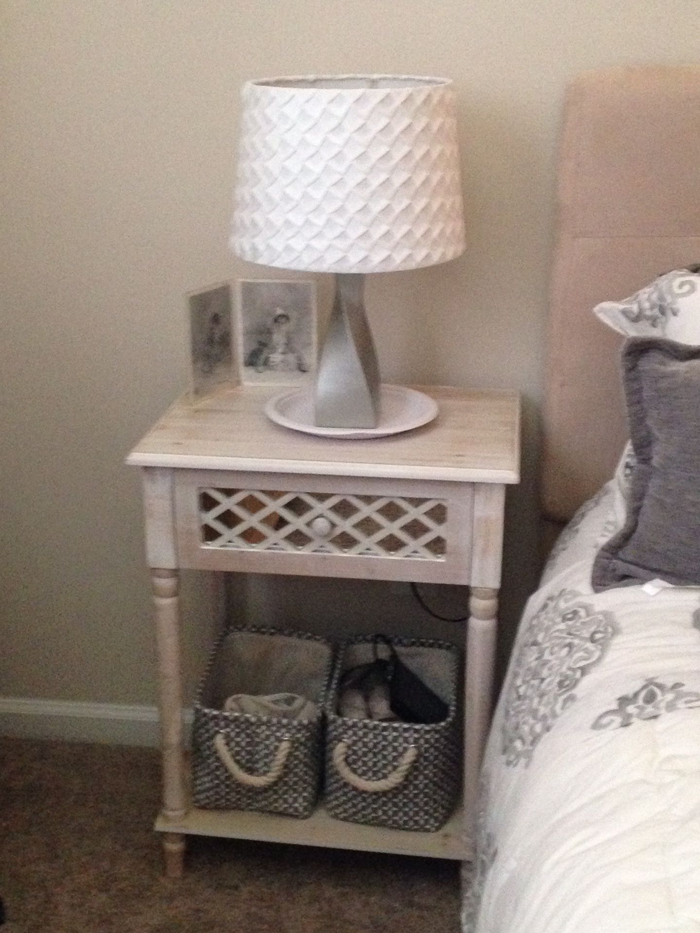 Mirror/lattice Small night stand, lamp, and baskets