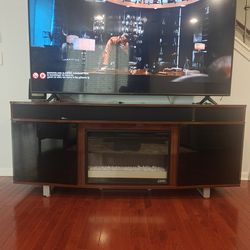 TV stand with fireplace and speakers
