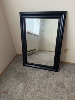 Black framed beveled mirror 31” x 42”