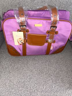 purple and brown "Petcare" branded pet carrier bag
