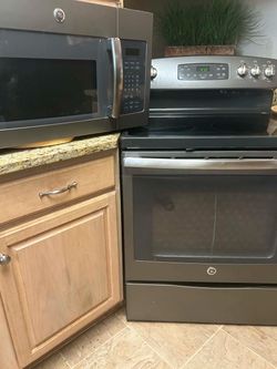Black stainless steel GE stove and microwave