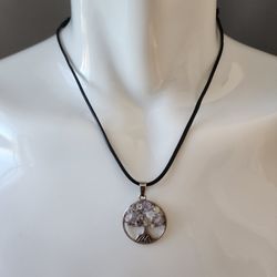 Amara – Tree of Life Amethyst Pendant, Adjustable Rope Necklace

Amara is a round Tree of Life pendant featuring a cutout metal design with polished A