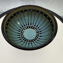 Beautiful Roger Allen Stripeware Studio Art Pottery bowl features a distinctive black and white striped pattern with a turquoise interior glaze. It is