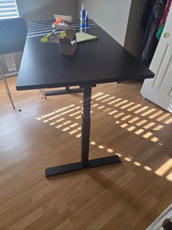 Black adjustable height desk