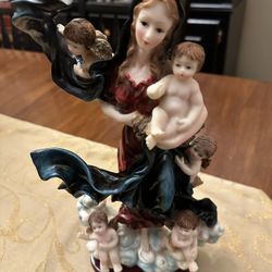  Mary Undoer of Knots (Virgen Desatanudos) figurine, typically crafted from resin for home decor or religious devotion.  