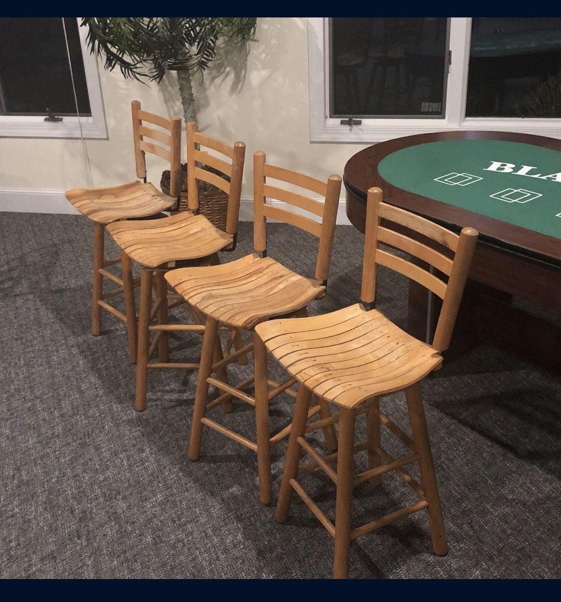 4 Wood swiveling bar stools. Nothing Wrong With them 