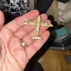 vintage gold-tone airplane brooch adorned with clear rhinestones. 