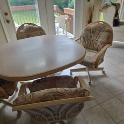 Dinette Set ,4 Chairs on rollers,all wood 