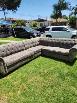 Tufted Gray Sectional Sofa with Nailhead Trim
