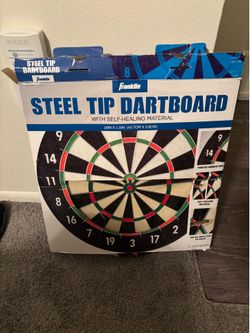 Dart board with steel tip darts