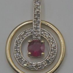 14kt yellow gold pendant w 27 diamonds 0.15pts  and ruby 0.25pts  2.7 grams . circle spins. 875202-1 